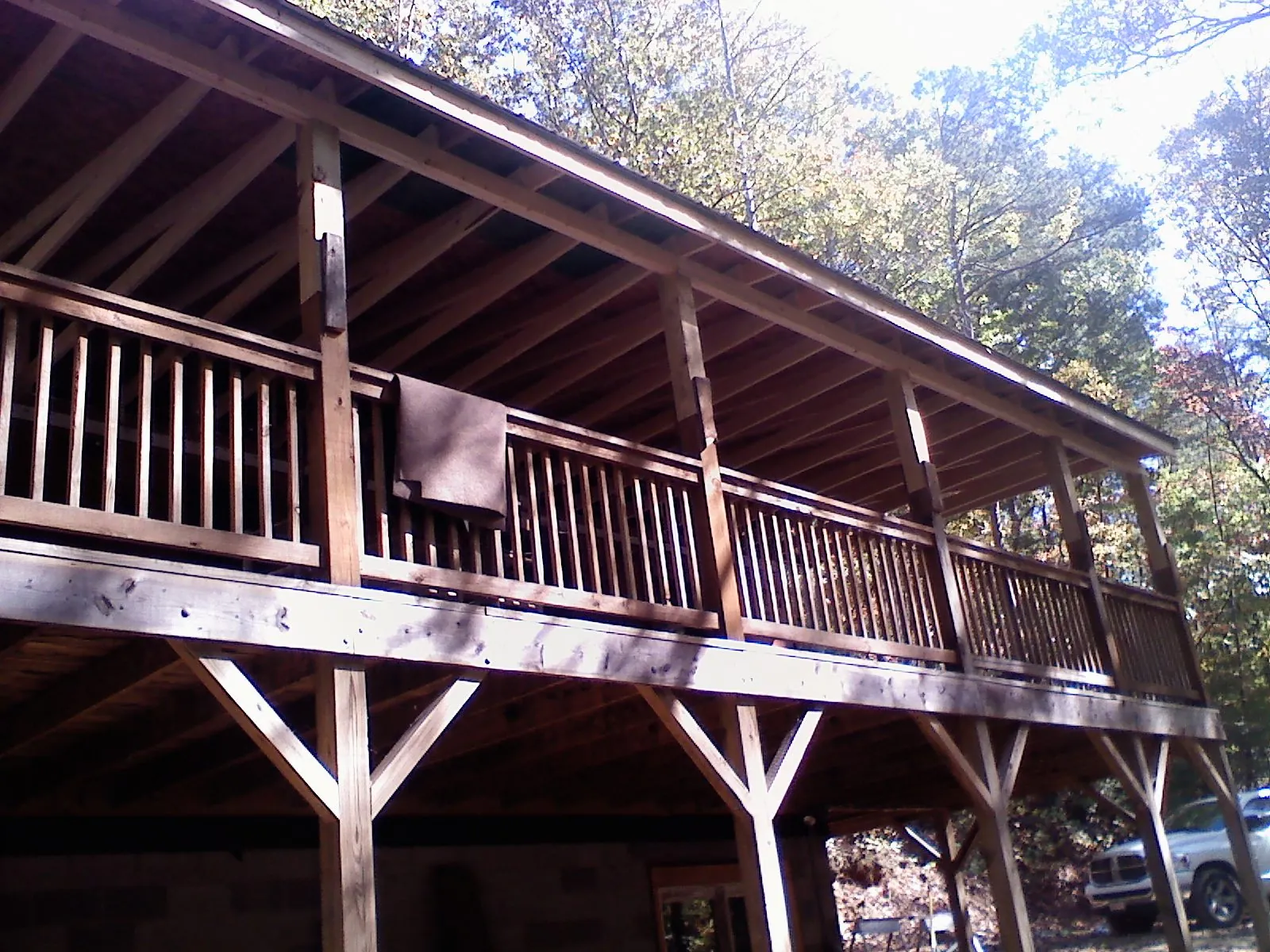 Timber framing under a new elevated porch and deck — Roof Leak Repair in Laconia by Roofing Brothers